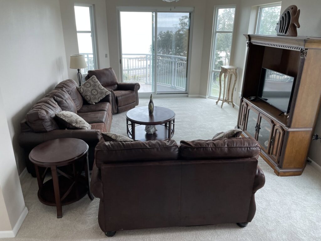Newly installed light-colored carpet in a spacious living room by Flooring Dunn Right in Biloxi, MS