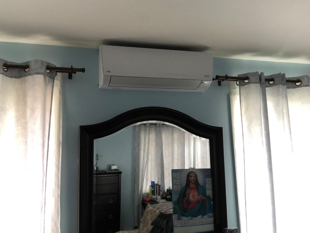 A newly installed Fujitsu mini-split indoor unit in a bedroom by Air Perfection, LLC in Waipahu, HI.