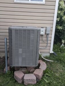 A newly installed outdoor air conditioning unit, ready to provide comfort from 72 Degrees in Ankeny, IA.
