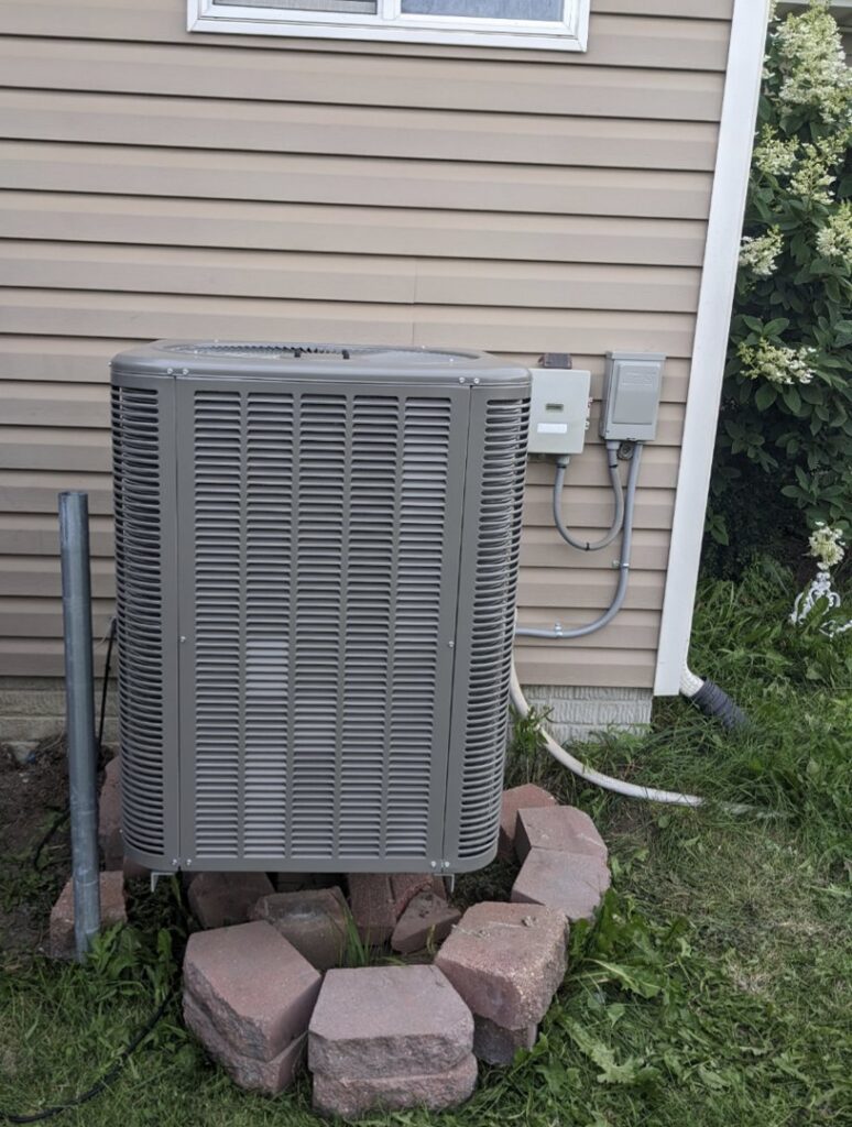 A newly installed outdoor air conditioning unit, ready to provide comfort from 72 Degrees in Ankeny, IA.
