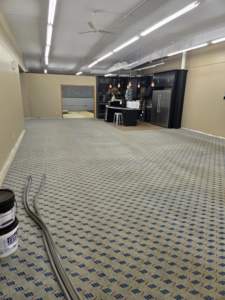 A large room with newly installed patterned broadloom carpet by Centennial Carpet & Flooring in Mitchell, SD.