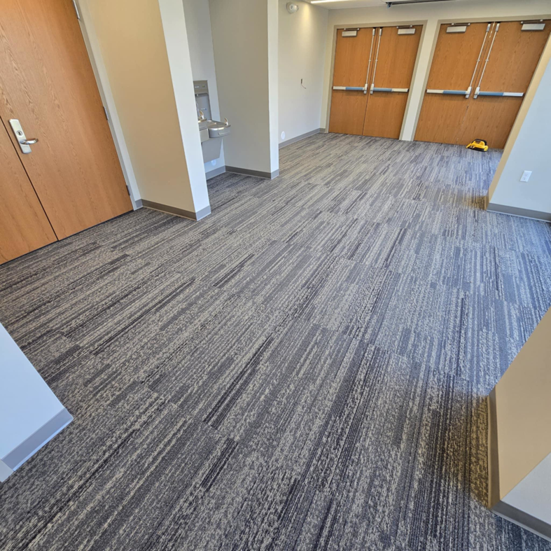 Newly installed patterned grey carpet in a commercial space by LaValle Flooring Inc - Jamestown, ND