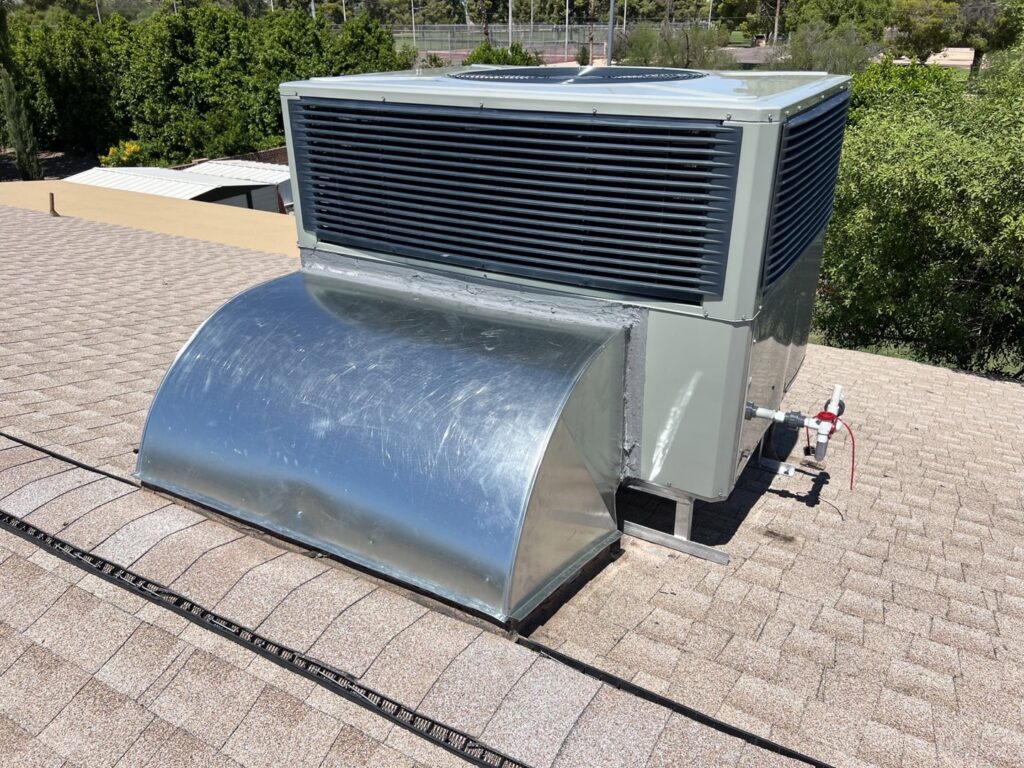 A newly installed rooftop package unit HVAC system with custom ductwork by 365 Mechanical in Mesa, AZ.