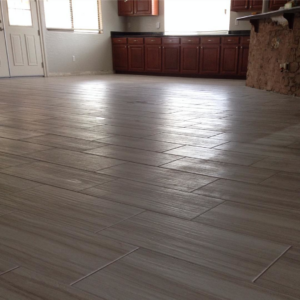 A spacious room featuring newly installed tile flooring, showcasing the quality work by Details Carpet and Tile Care in Las Vegas, NV.