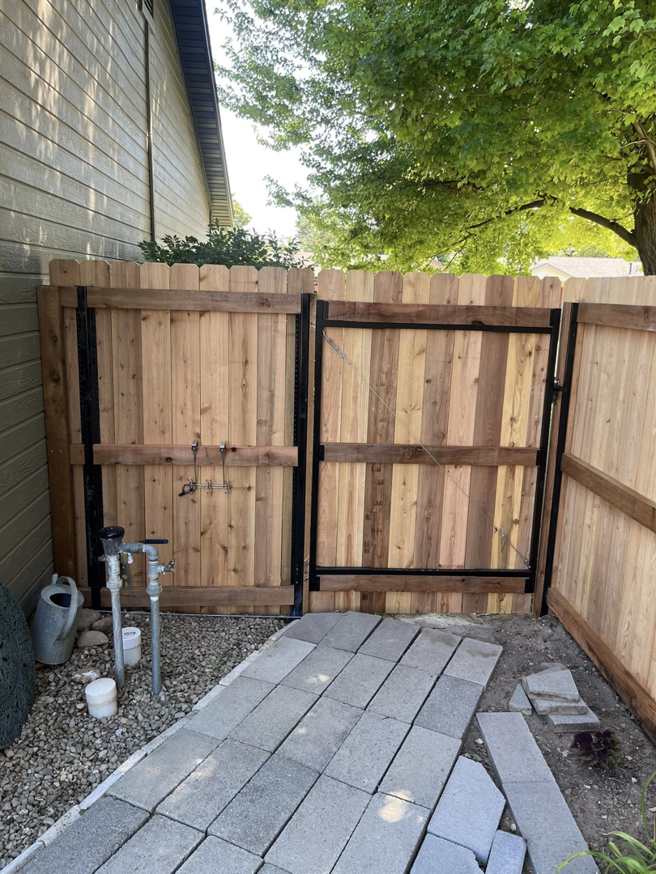 Newly installed wood double gate by Builders choice Fence, Deck & Patio Covers in Nampa, ID