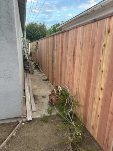A newly installed vertical wood fence in a side yard by Don Peterson Wood Fences & Decks in Santa Monica, CA.