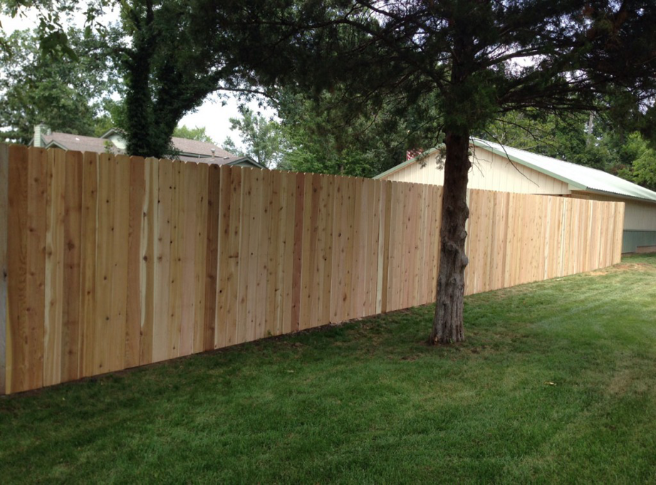 A newly installed wood fence providing privacy and boundary definition by Prattville Fence Contractor in Prattville, AL.