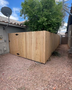 A newly installed wood privacy fence section in a residential backyard by 702 Fence LLC in Las Vegas, NV.