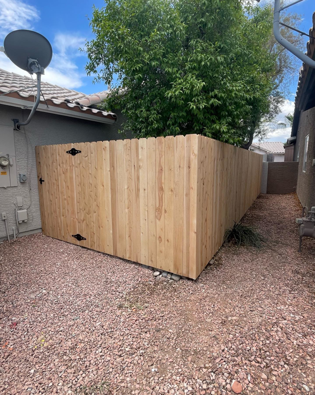 A newly installed wood privacy fence section in a residential backyard by 702 Fence LLC in Las Vegas, NV.