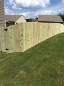 A newly installed wood privacy fence in a residential backyard by Castillo Fences in Sacramento, CA.