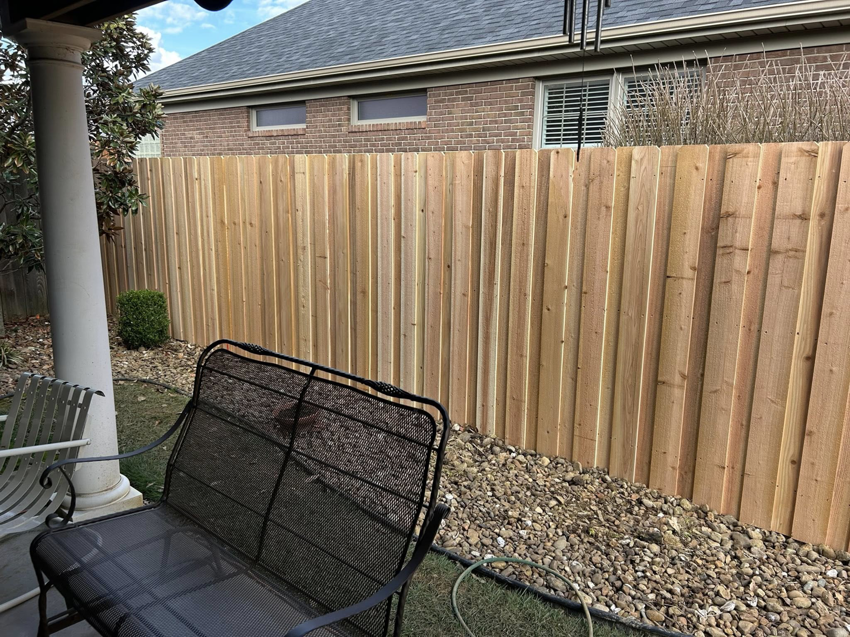 A newly installed wood privacy fence by Rager Fencing & Lawn Care, LLC in Owensboro, KY.