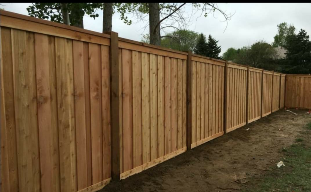 A newly installed wood privacy fence by Weber Deck & Fence in Baton Rouge, LA.