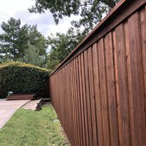 A newly installed wooden privacy fence, showcasing quality work by Reliable Texas Fencing in Fort Worth, TX.