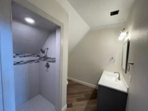 Northern Nevada Electric LLC work trucks parked outside a commercial building in Reno, NV, ready for electrical service.
