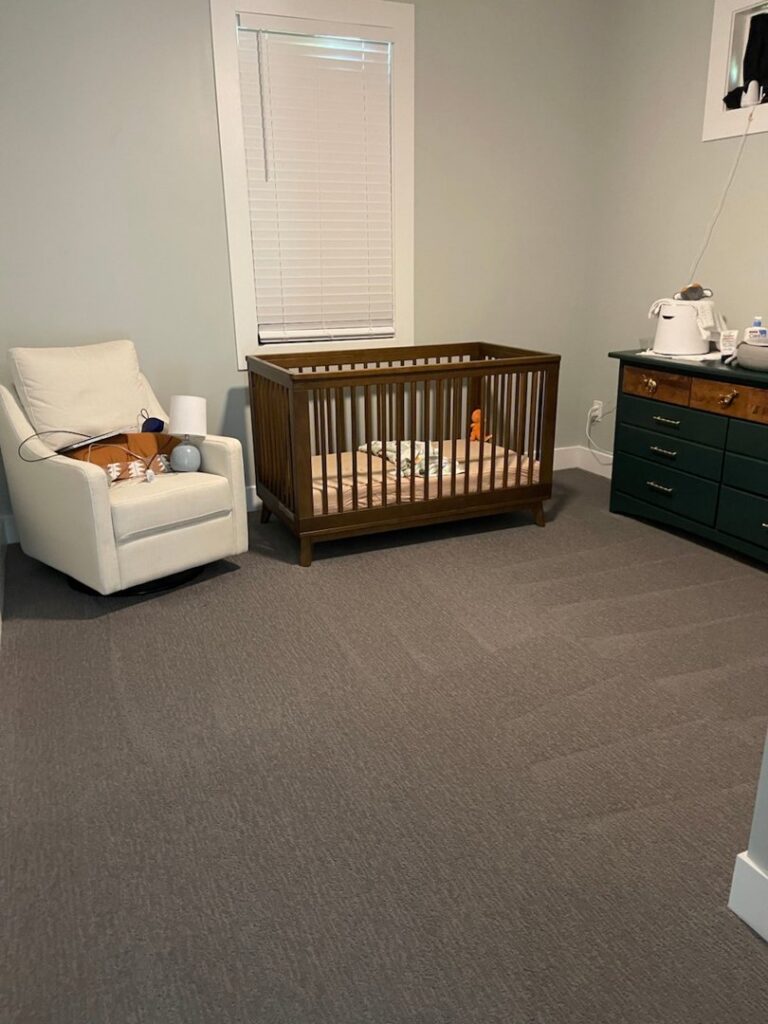 A nursery room with clean, dark grey carpet by My Carpet Cleaner Nashville, TN