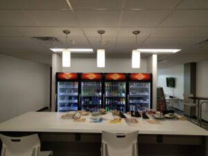 Office breakroom featuring modern pendant and recessed lighting installed by VIP Electrical Services in Naperville, IL.