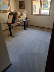 An office room with light-colored carpet displaying fresh cleaning patterns from Pueblo's Best Carpet & Air Duct Cleaning in Pueblo West, CO.