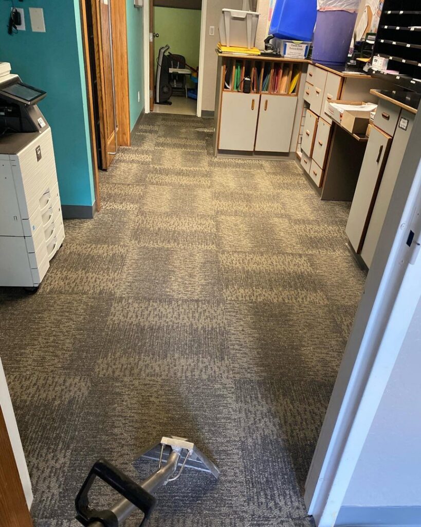 Professional carpet cleaning in an office hallway by The Floor Care Guys in Bentonville, AR.
