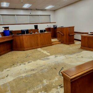 Modern grey carpet tiles installed in an empty office space, a commercial carpet installation by Affordable Carpet & Flooring in Dallas, TX.