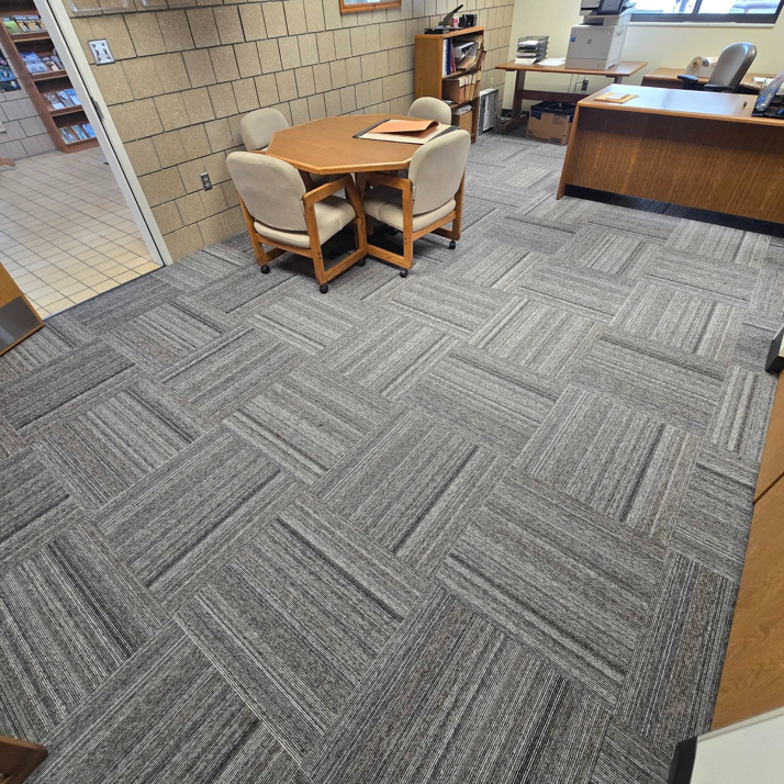 Newly installed grey carpet tiles in an office space by LaValle Flooring Inc - Valley City in Valley City, ND.