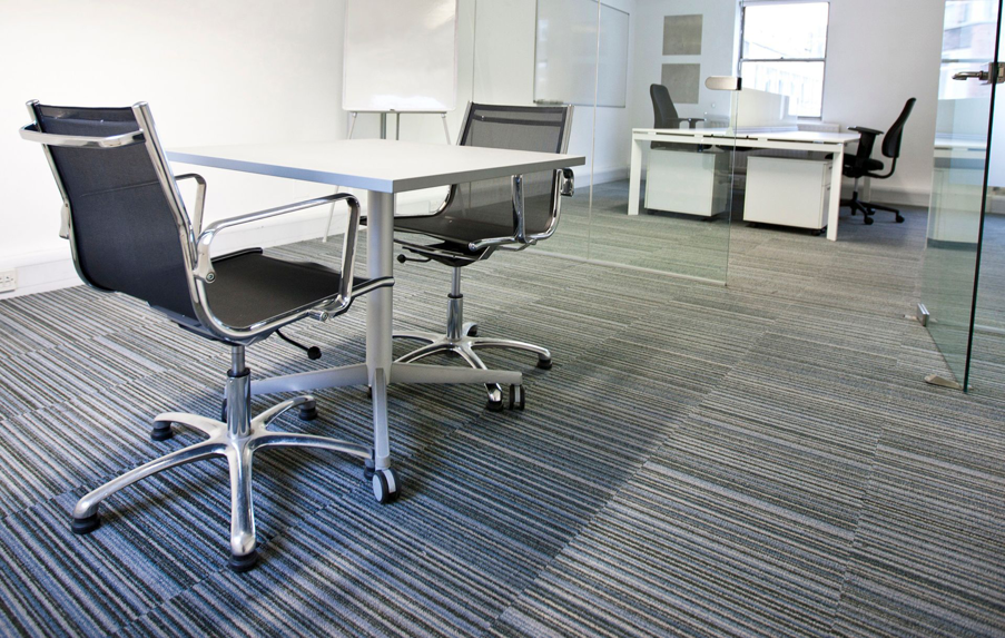 Modern office space with new carpet tile installation by Superior Interiors Inc. in Virginia Beach, VA.