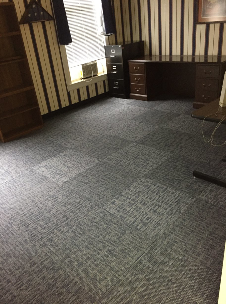 An office room showcasing a professional carpet tile installation by Tony Trujillo Flooring Sales & Installation in Franklin, TN.
