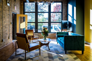 A stylish chandelier installed in a modern office lounge area by Flavin Electric, LLC in Chicago, IL