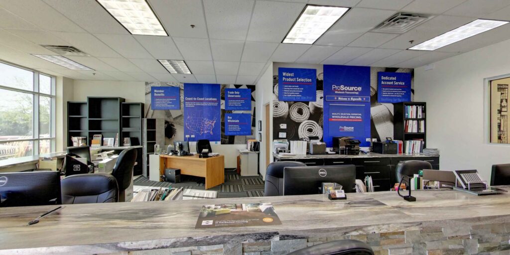 Interior of the ProSource Flooring Kitchen & Bath office in Naperville, IL, featuring modern carpet tiles.