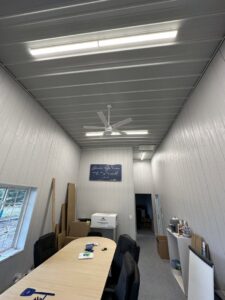 New fluorescent lighting and a ceiling fan installed in an office space by Schroeder Electric in Duluth, MN.