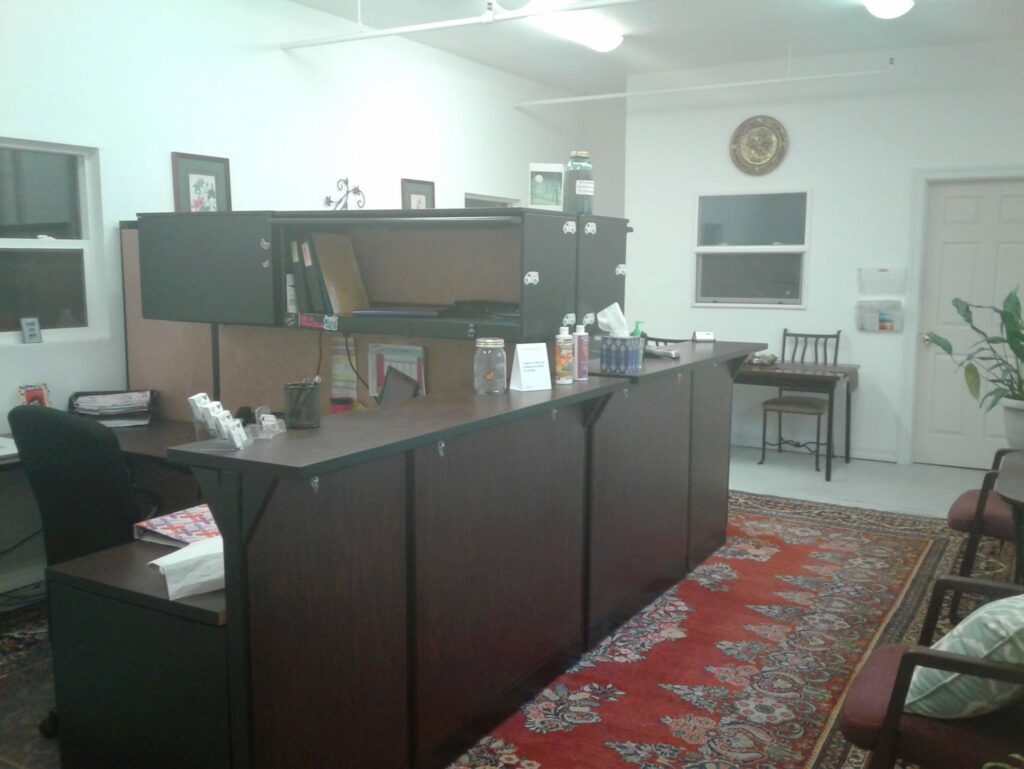 A welcoming office reception area featuring a large patterned rug by Alameda Carpet & Upholstery Cleaners in Portland, OR.