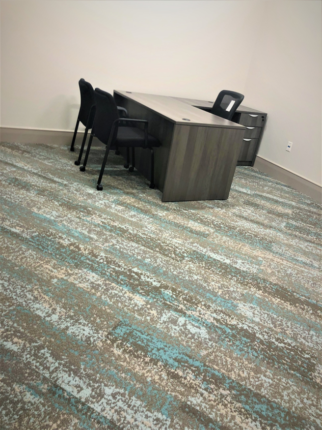 An office room showcasing a modern patterned carpet installation by Gene's Floor Covering II in Gulf Shores, AL.