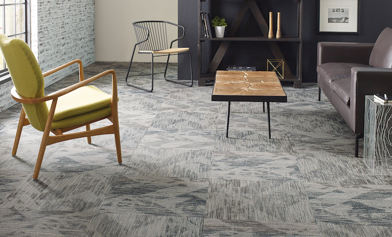 An office or living space featuring a stylish carpet tile installation by Bowcutt's Flooring America in Bluffdale, UT.