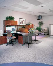 An office space featuring a new light grey carpet installation by Har-Pat Flooring in Havertown, PA.