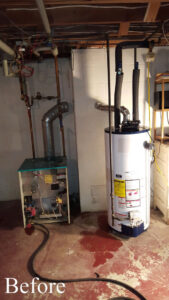 An old boiler and water heater setup before replacement by Nimmer Heating & Air Conditioning in Milwaukee, WI