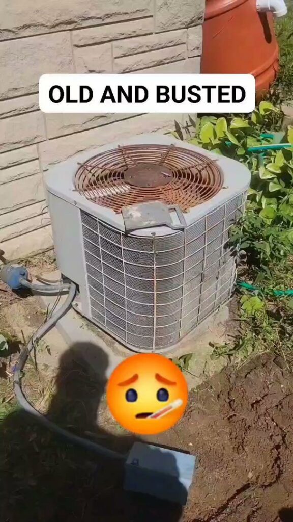 An old and rusted outdoor AC unit labeled "OLD AND BUSTED," indicating a need for replacement by Hodges Heating & Cooling in Owensboro, KY.