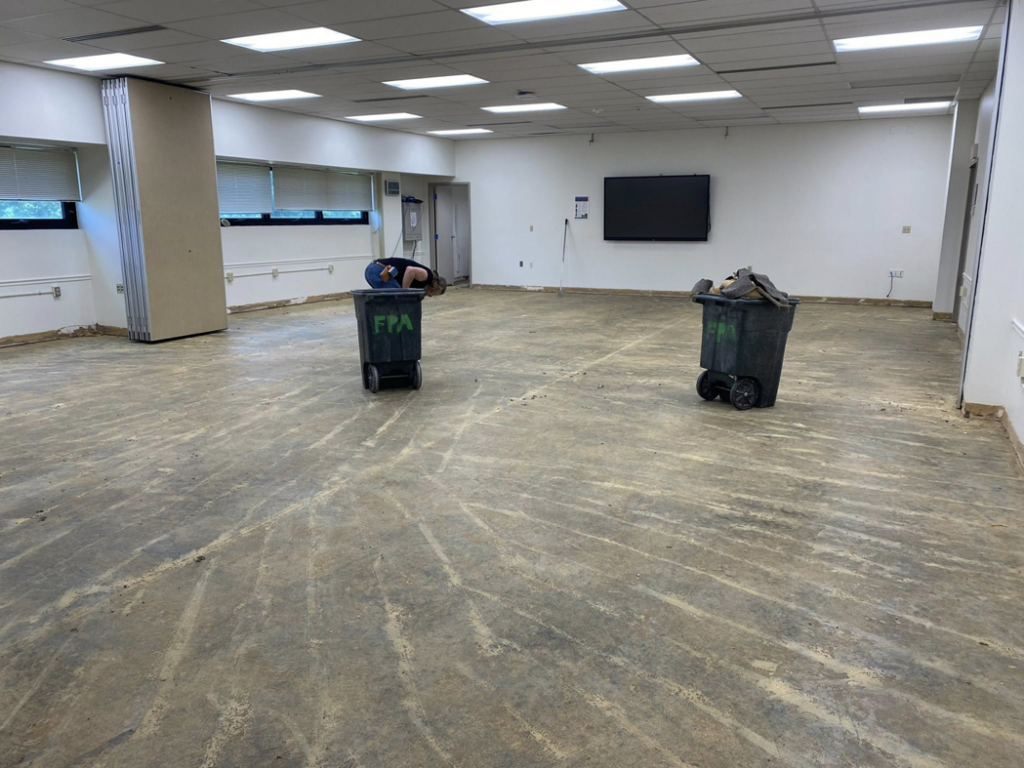 Old carpet removed, revealing the concrete subfloor during a job by Floor Perfection of Arkansas in Conway, AR