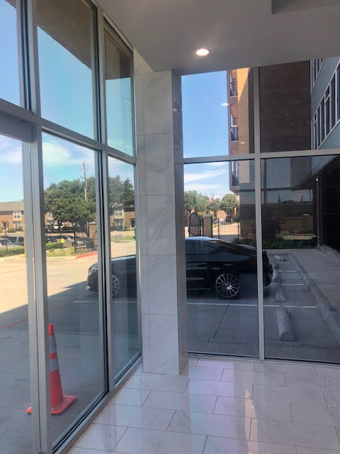 Old, worn carpet removed to expose the subfloor in a utility room, showing a carpet removal job by Affordable Carpet & Flooring in Dallas, TX.
