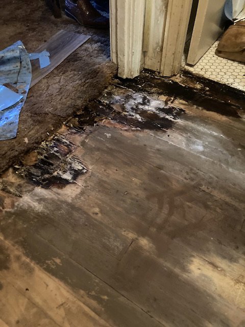Old carpet and underlayment being removed to prepare the subfloor for new installation by LL Flooring in San Antonio, TX