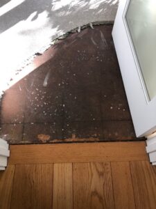 Exposed subfloor after old carpet removal, preparing for new flooring by Straus Carpets in Oakland, CA.