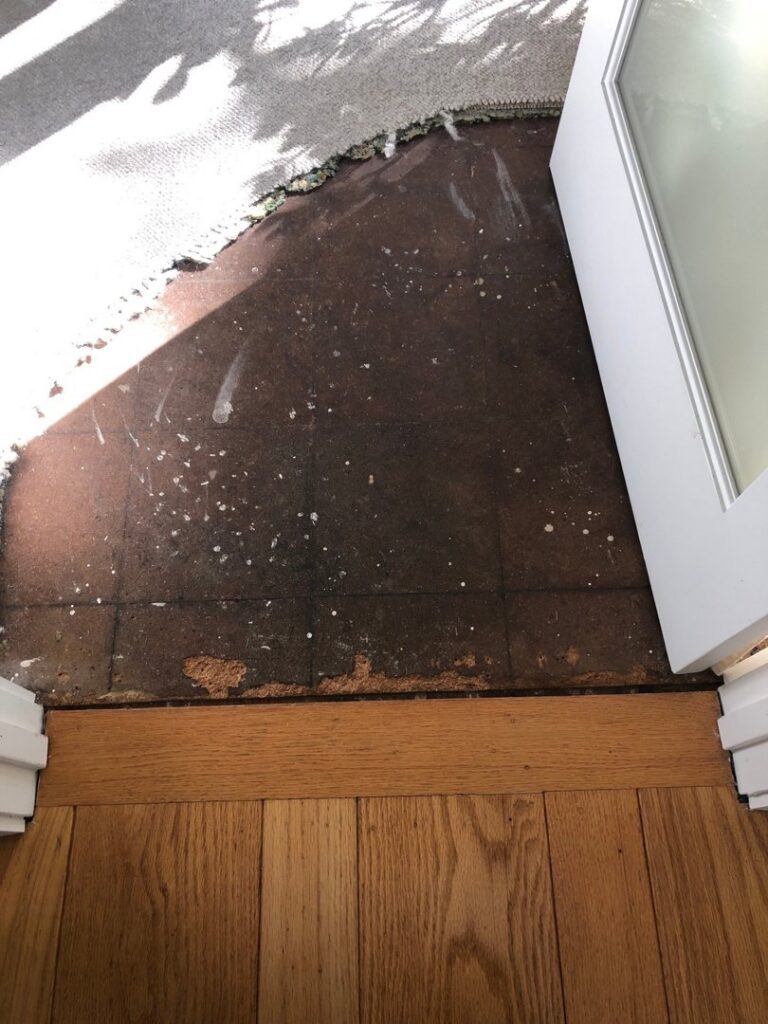 Exposed subfloor after old carpet removal, preparing for new flooring by Straus Carpets in Oakland, CA.