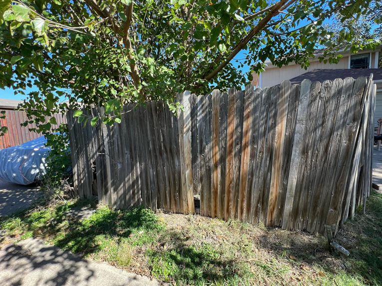 An old, dilapidated wooden fence with broken boards, showing a need for repair or replacement by True Ways Services LLC in Mesquite, TX.