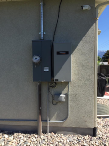 A close-up view of an old electrical fuse box and wiring, showing potential work for Live Wire Service in Salt Lake City, UT.