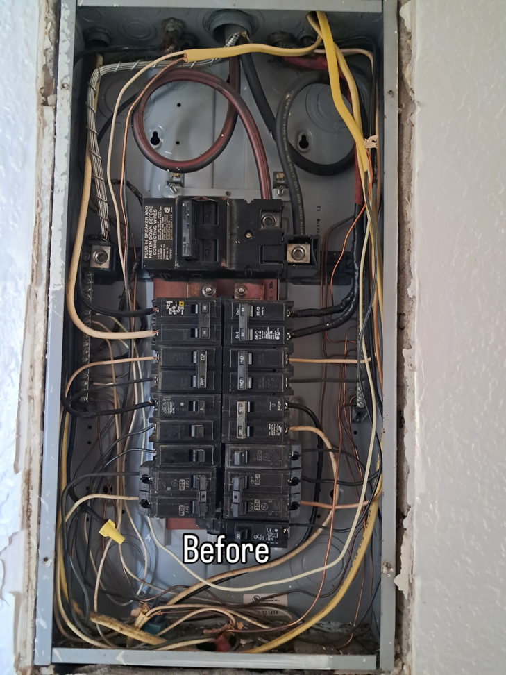 An old electrical panel with numerous wires and circuit breakers before an upgrade by Bold City Electric in Jacksonville, FL.