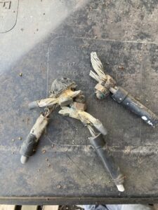 Old, severed electrical service cables and wires, likely removed during an upgrade by Diaz Techician LLC in Chicago, IL.
