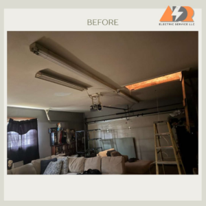 Old fluorescent tube lights and a ceiling heater in a garage before an electrical upgrade by ADR Electric in Indianapolis, IN.