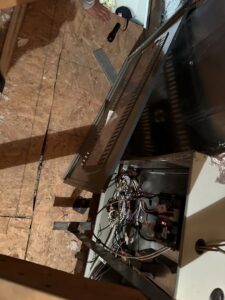 Components of an old indoor furnace and air handler unit removed and placed on a drop cloth by ASAP Air Conditioning and Heating in Mesa, AZ.