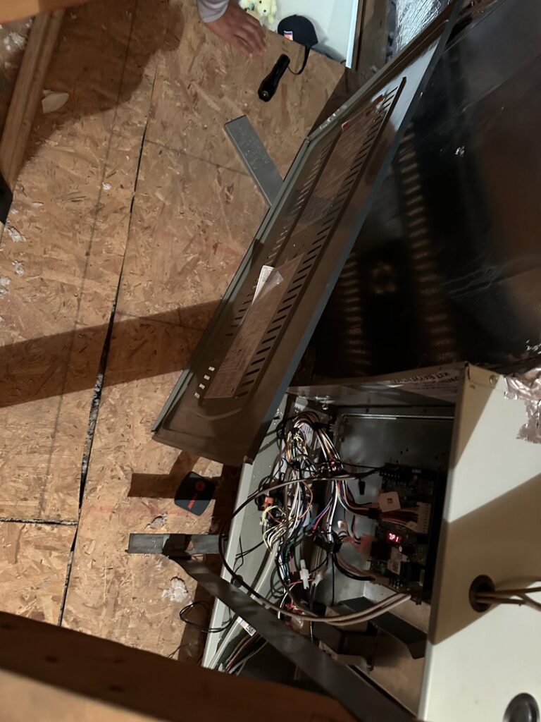 Components of an old indoor furnace and air handler unit removed and placed on a drop cloth by ASAP Air Conditioning and Heating in Mesa, AZ.