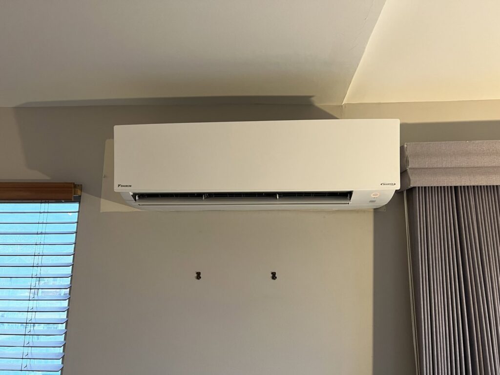 An old furnace and air handler unit with ductwork, likely undergoing replacement by Riccardi Heating and Air in Toms River, NJ.