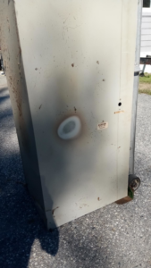 An old furnace or heating unit being removed by Aaron Hamilton Heating in Brunswick, ME.