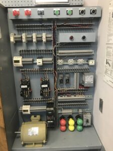 An old fuse box with various fuses and wiring, representing electrical systems serviced by High Electrical in Atlanta, GA.